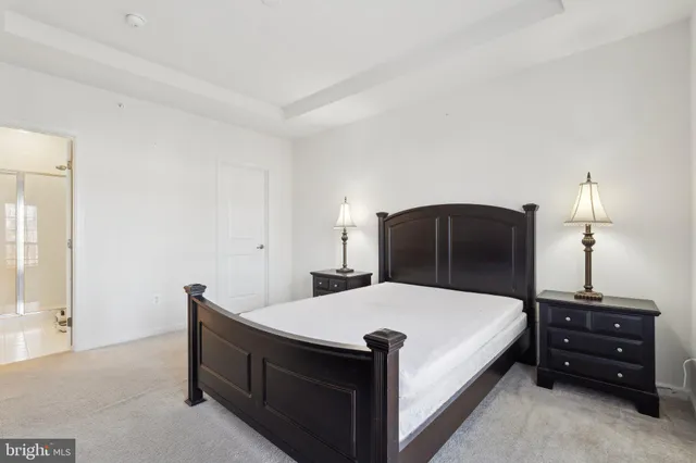 a bedroom with a bed and a mirror