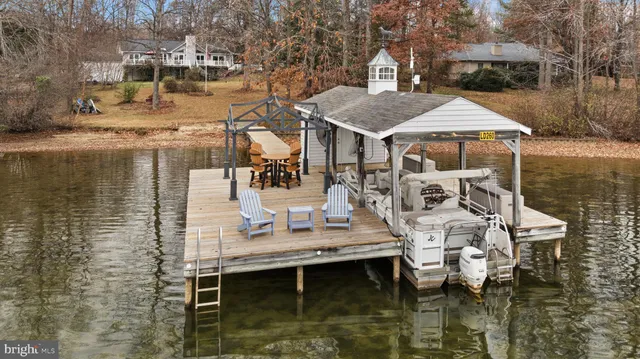 a front view of a house with sitting area