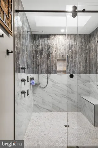 a view of a house with a yard covered with large trees