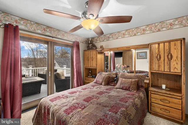 a view of a chairs and tables in the back yard