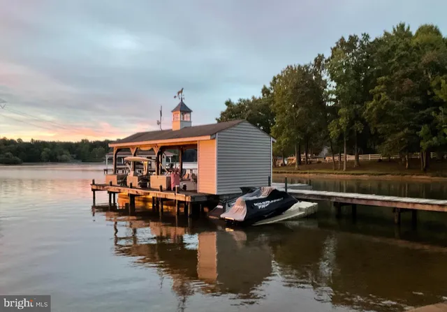 a view of a yard with large trees