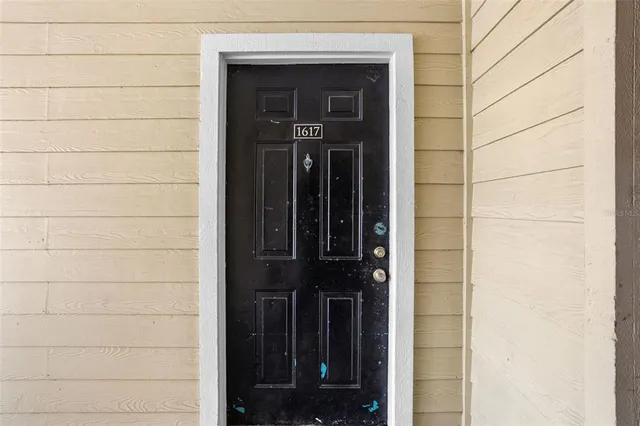 a view of a city with lush green forest