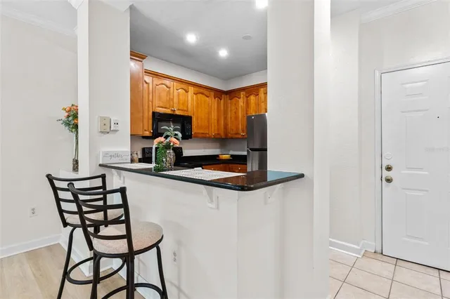 a kitchen with a sink cabinets and window