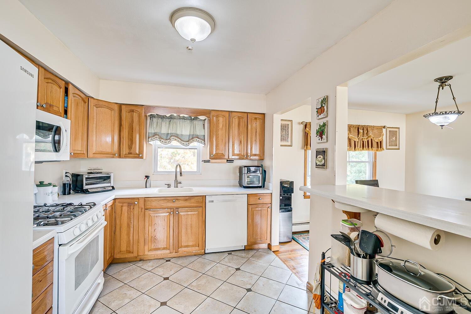 48 Brandywine Road Fords, NJ 08863 - Photo 13 of 29 a kitchen with a sink appliances and cabinets
