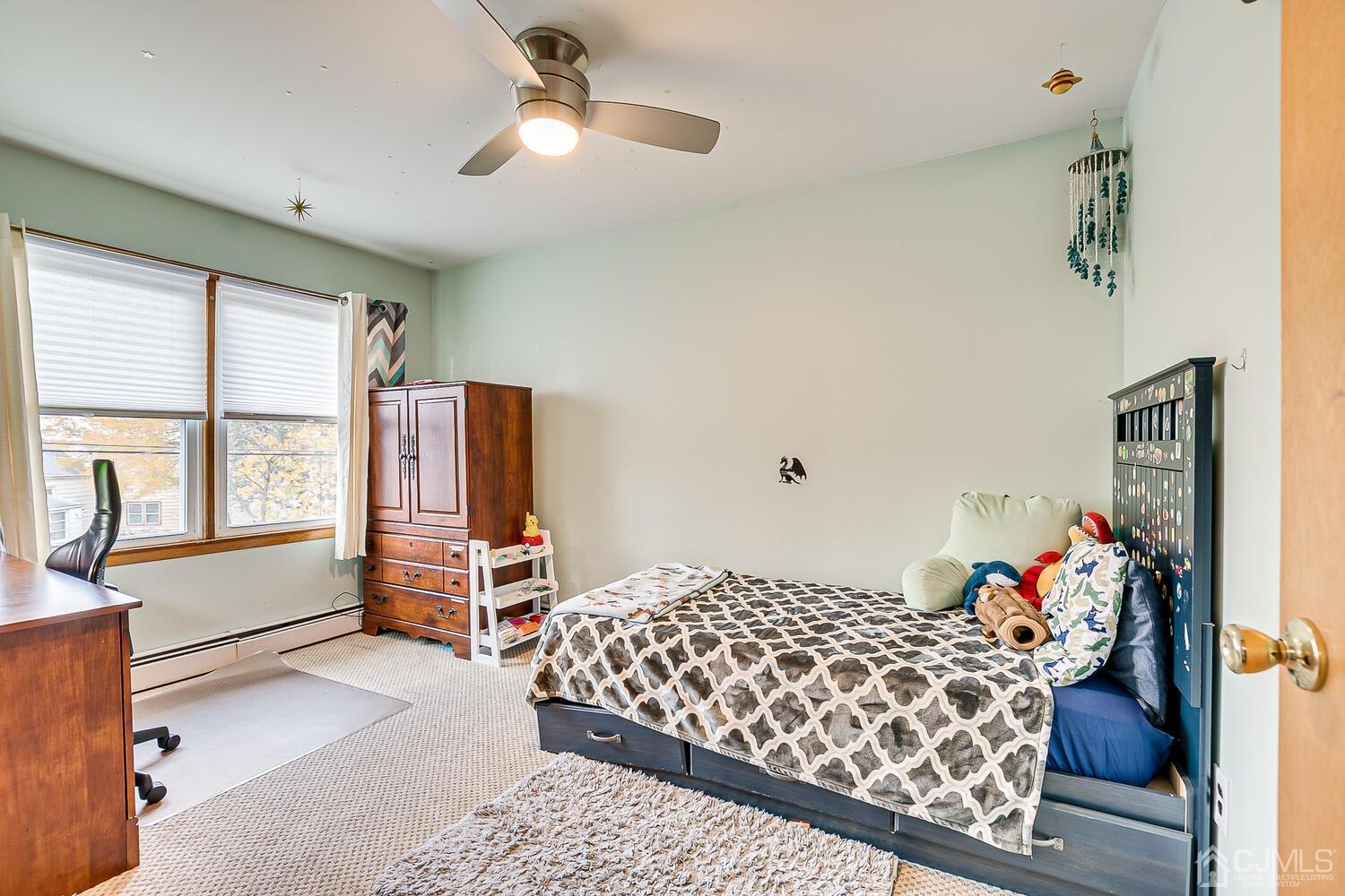 48 Brandywine Road Fords, NJ 08863 - Photo 16 of 29 a bedroom with furniture and a window
