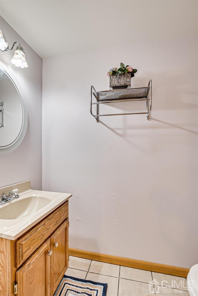 48 Brandywine Road Fords, NJ 08863 - Photo 20 of 29 a room with a sink and a mirror