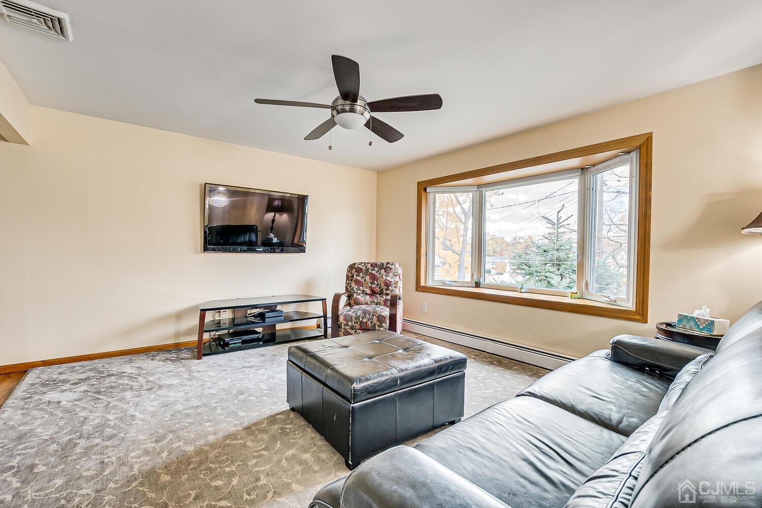 48 Brandywine Road Fords, NJ 08863 - Photo 6 of 29 a living room with furniture and a flat screen tv