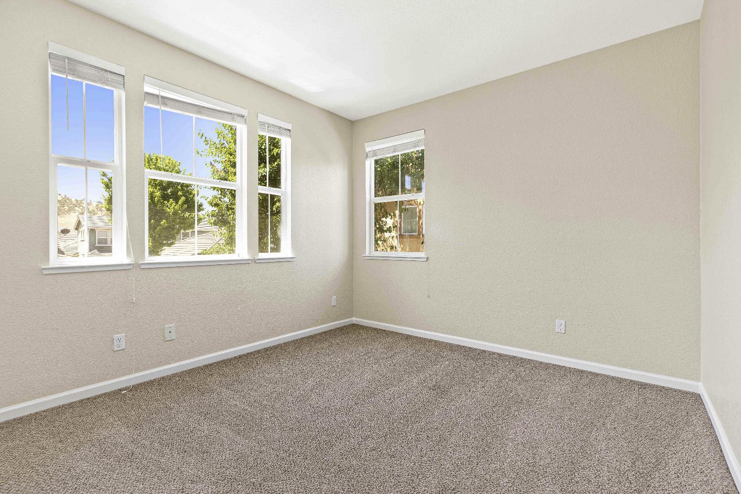 9397 Vintner Circle Patterson, CA 95363 - Photo 12 of 38 an empty room with a window