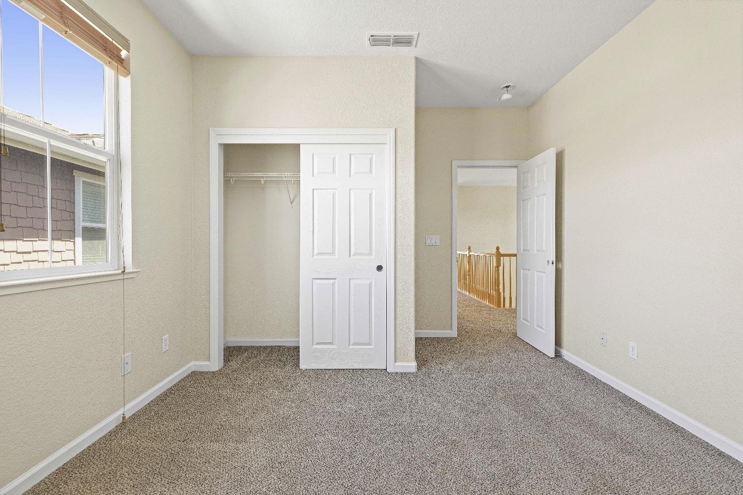 9397 Vintner Circle Patterson, CA 95363 - Photo 15 of 38 a view of an empty room with a window