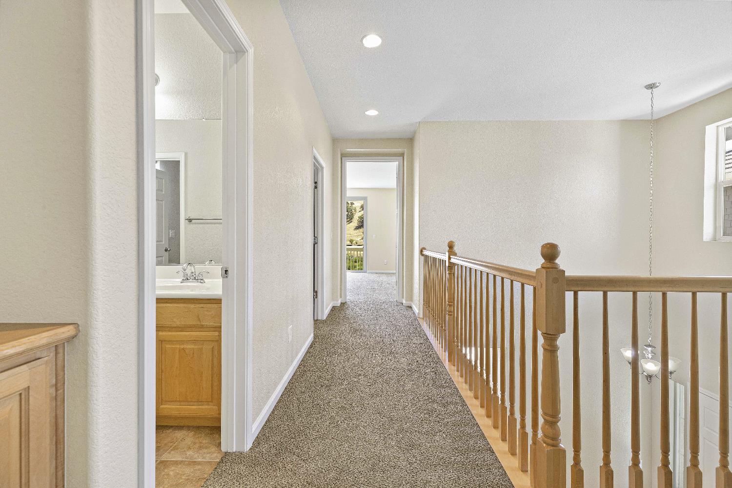 9397 Vintner Circle Patterson, CA 95363 - Photo 16 of 38 a view of hallway with wooden floor