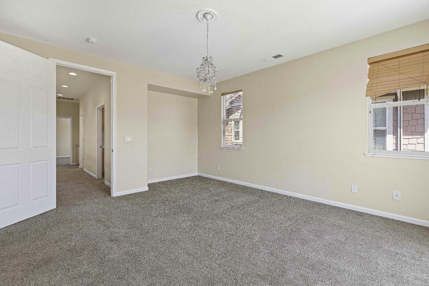 9397 Vintner Circle Patterson, CA 95363 - Photo 20 of 38 a view of an empty room with a window