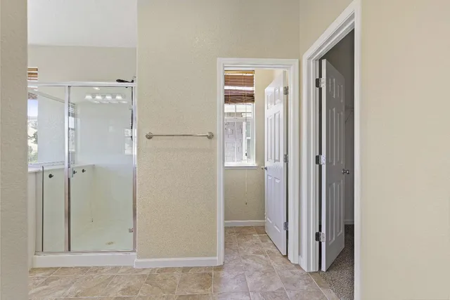 a view of a bathroom with a glass door