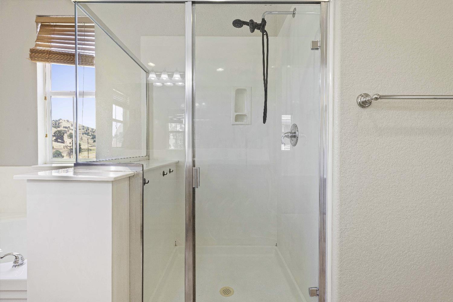 9397 Vintner Circle Patterson, CA 95363 - Photo 26 of 38 a bathroom with a shower and a sink