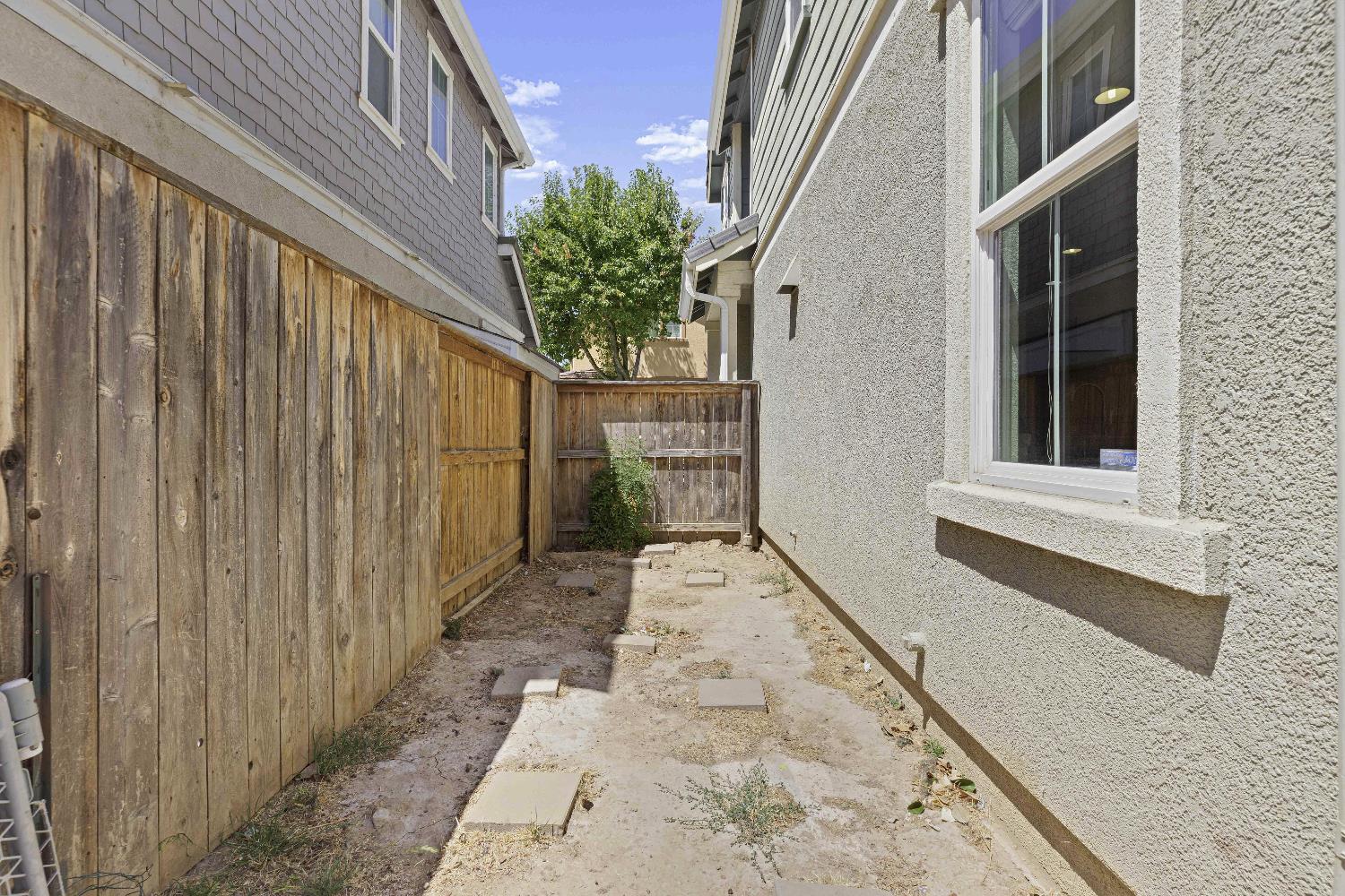 9397 Vintner Circle Patterson, CA 95363 - Photo 28 of 38 a view of a pathway with a house