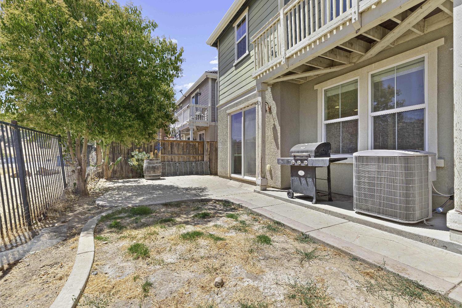 9397 Vintner Circle Patterson, CA 95363 - Photo 30 of 38 a view of a house with a wooden fence