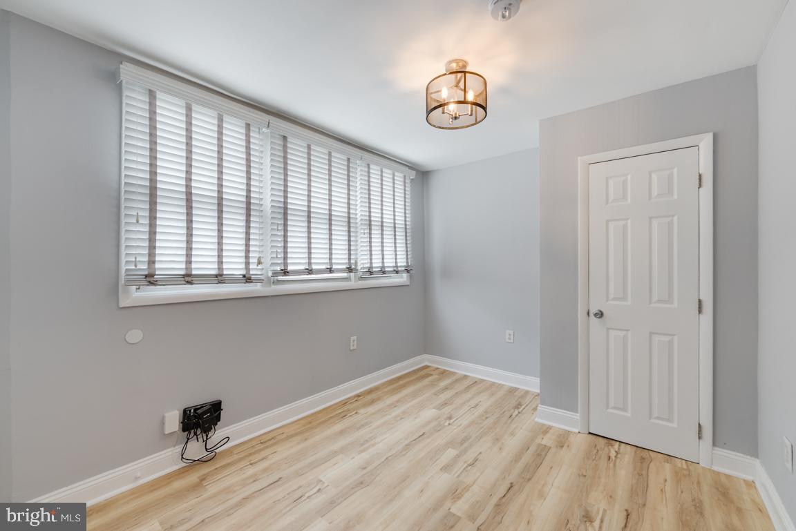1333 Adams Street Northeast, Unit 2 Washington, DC 20018 - Photo 12 of 15 a view of empty room with wooden floor and fan