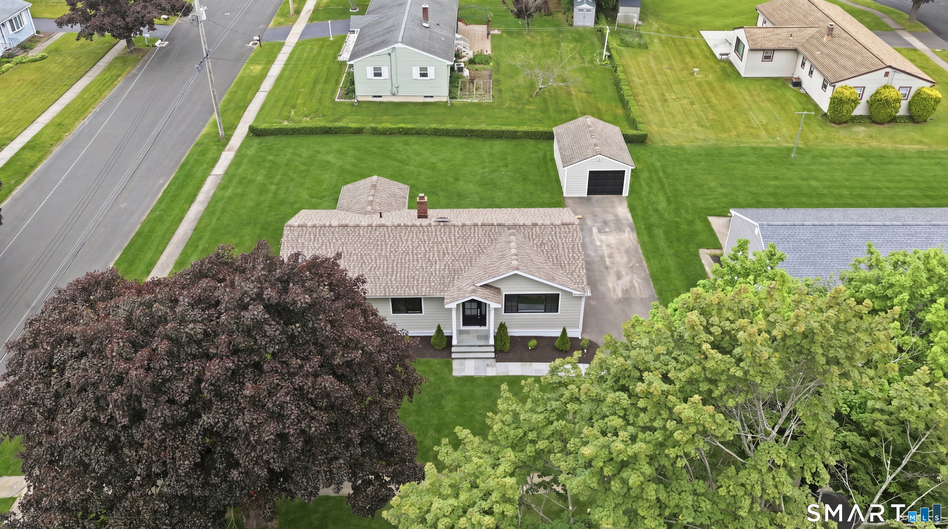 110 Russell Road Stratford, CT 06614 - Photo 31 of 31 an aerial view of a house with a garden and trees