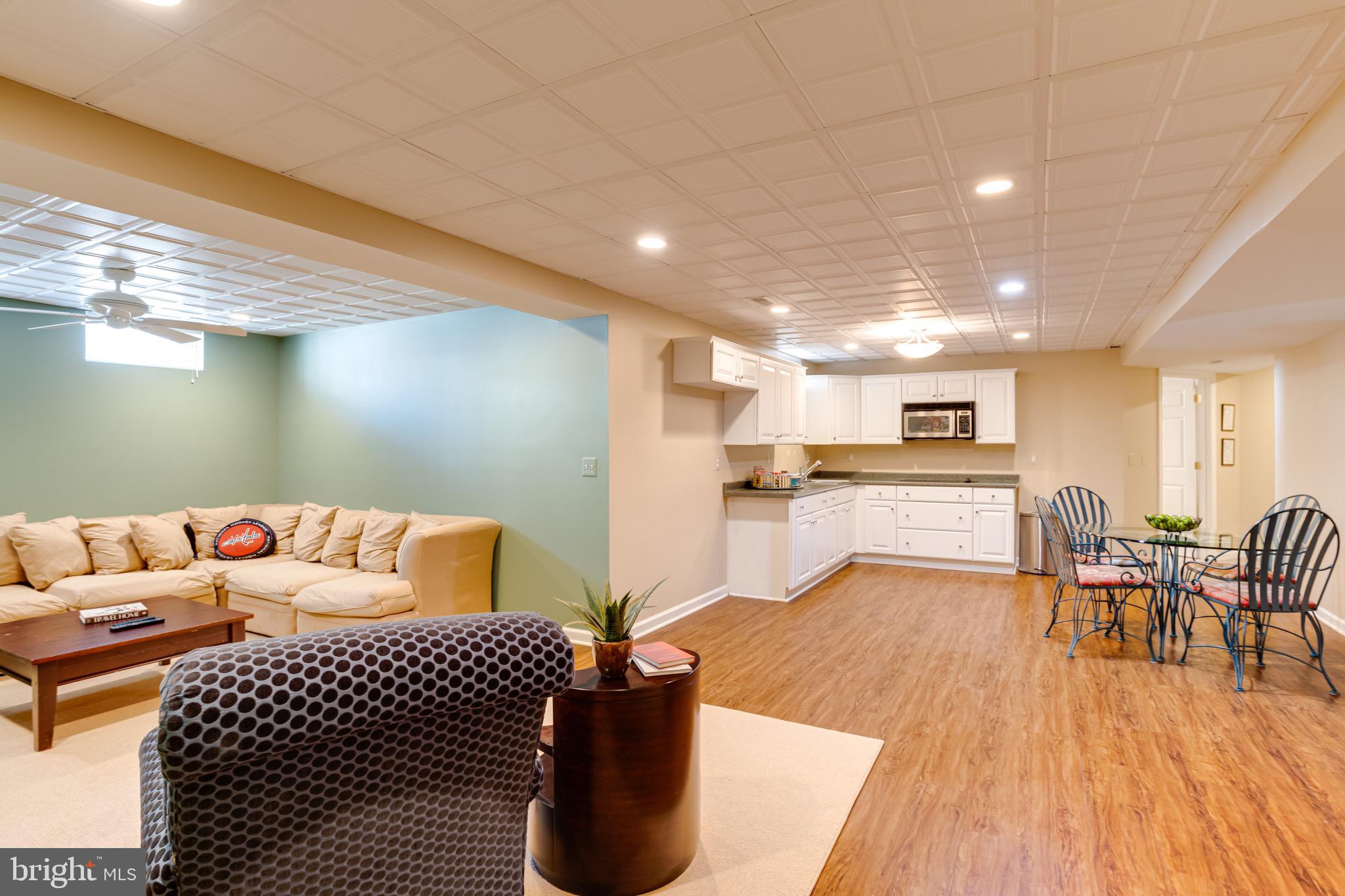 1911 Cranbourne Road Lutherville-Timonium, MD 21093 - Photo 63 of 75 Lower Level Family Room Open to 2nd Kitchen