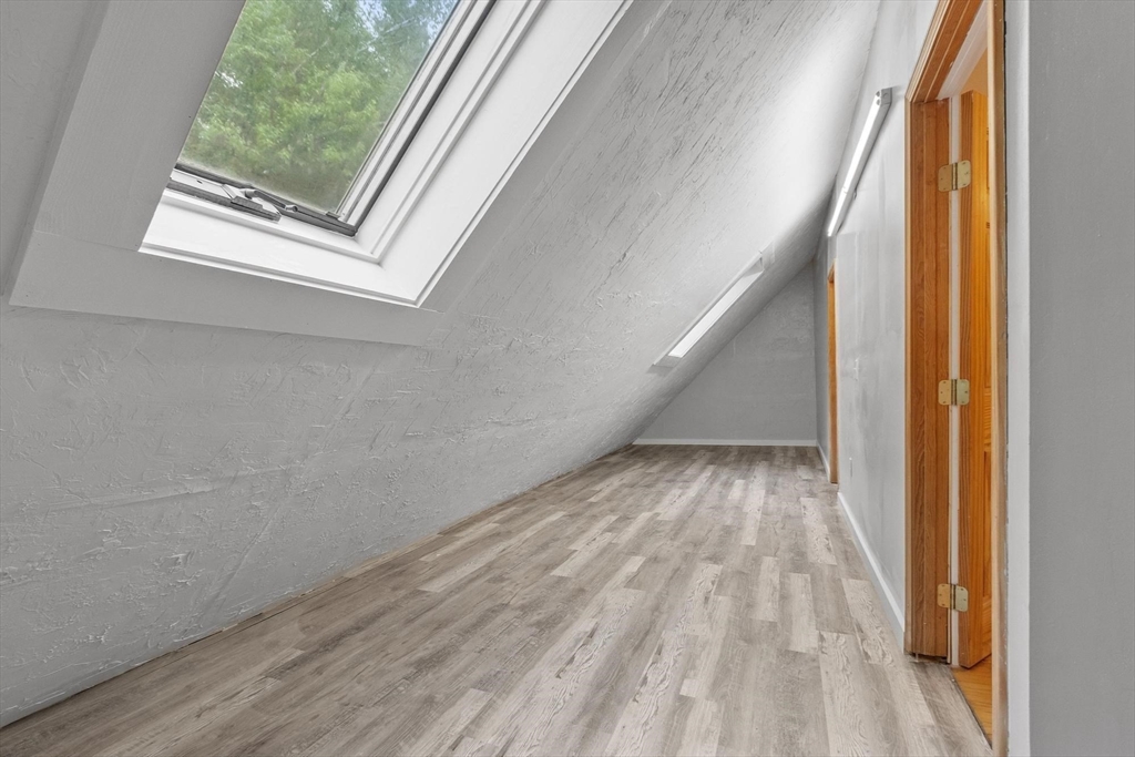 258 Allen Road Ashby, MA 01431 - Photo 25 of 36 a view of a small space with wooden floor and a window