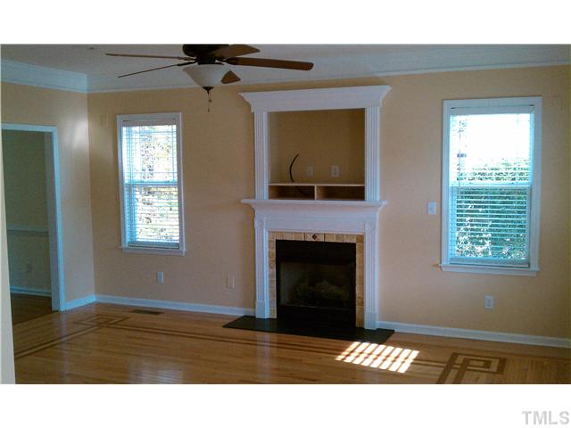 3005 Foundry Place Raleigh, NC 27616 - Photo 4 of 19 Family Room features fireplace with gas logs, ceiling fan & beautiful hardwoods