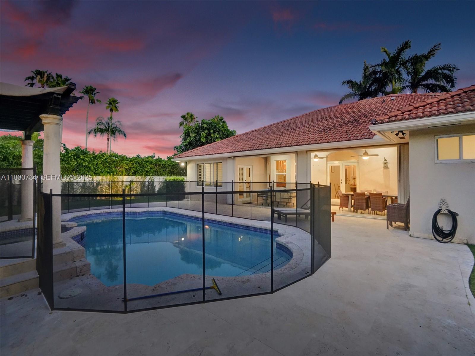 12401 Southwest 77th Street, Unit 12401 Miami, FL 33183 - Photo 11 of 95 a view of a backyard