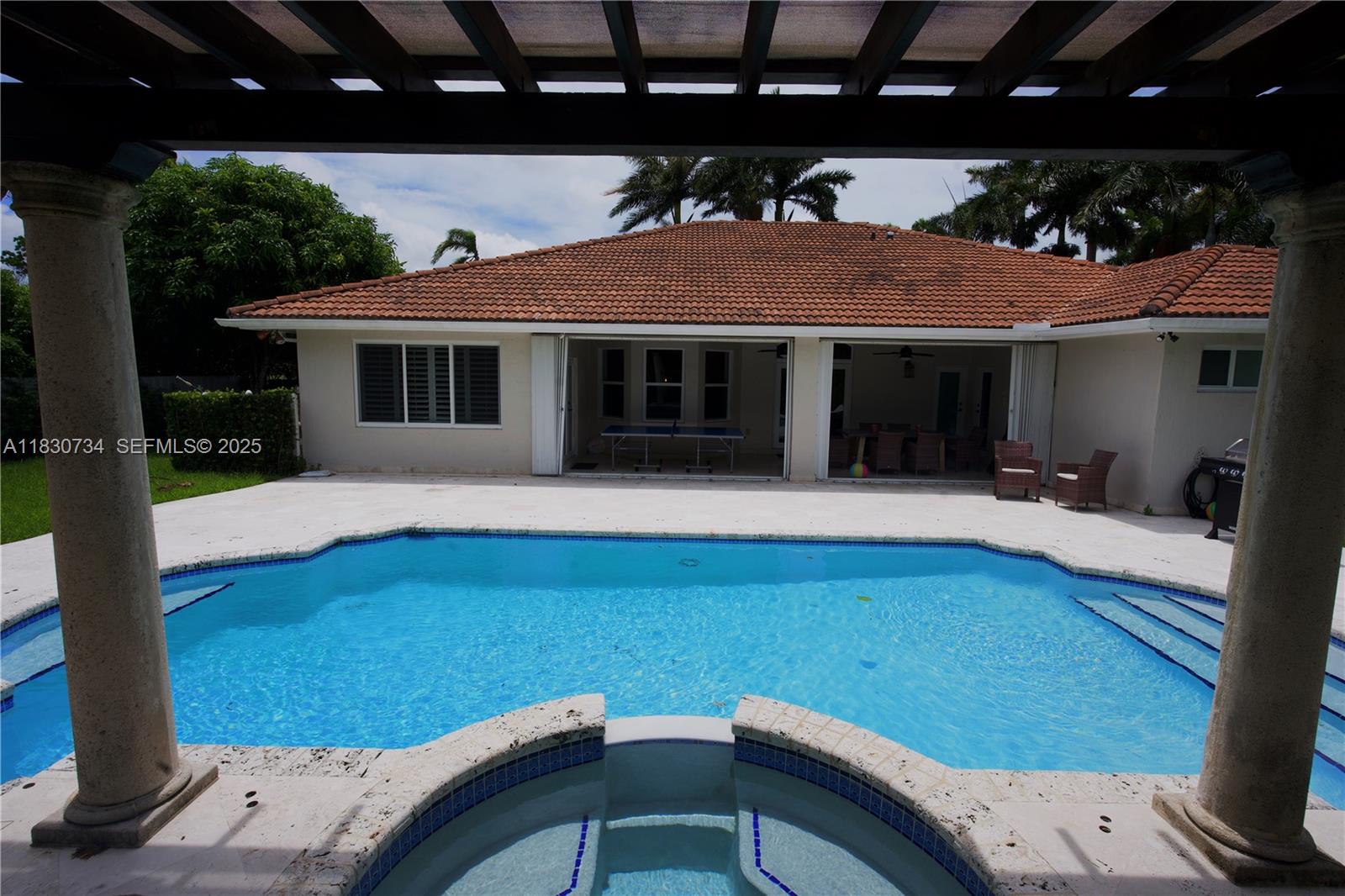 12401 Southwest 77th Street, Unit 12401 Miami, FL 33183 - Photo 17 of 95 a view of house with backyard outdoor seating and entertaining space