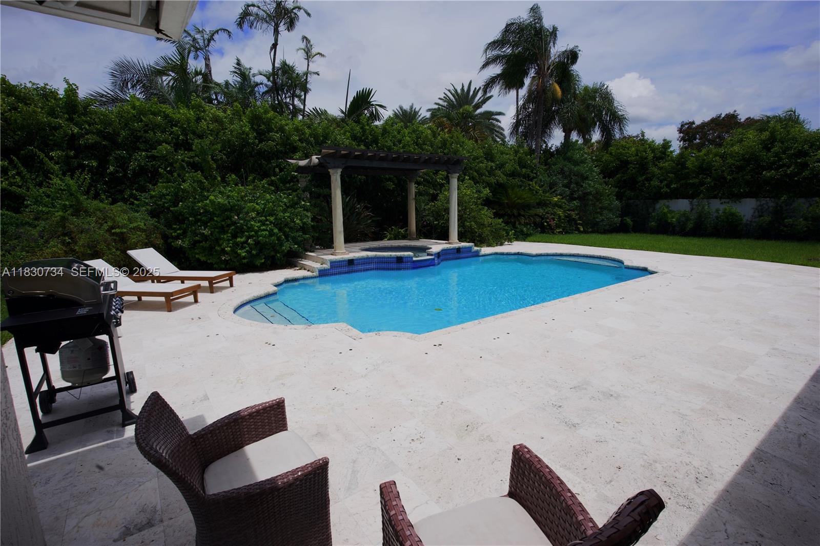 12401 Southwest 77th Street, Unit 12401 Miami, FL 33183 - Photo 19 of 95 a view of outdoor space yard swimming pool and patio