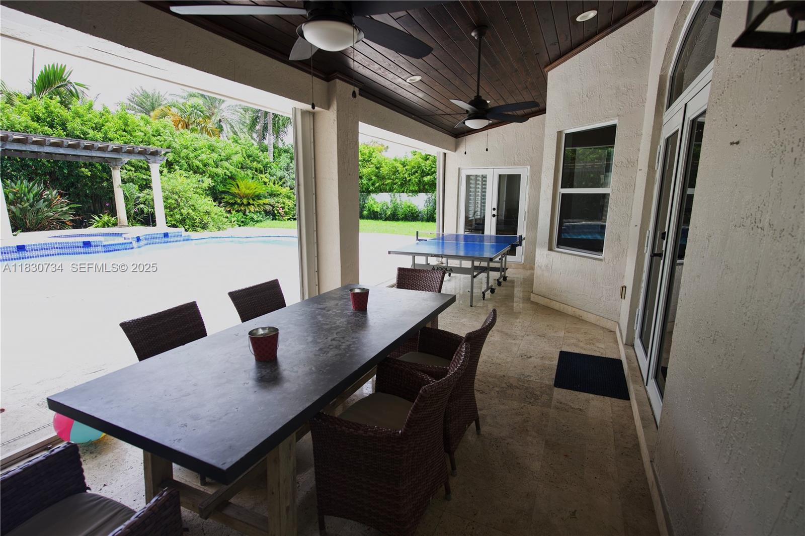 12401 Southwest 77th Street, Unit 12401 Miami, FL 33183 - Photo 21 of 95 a view of a dining room with furniture window and outside view