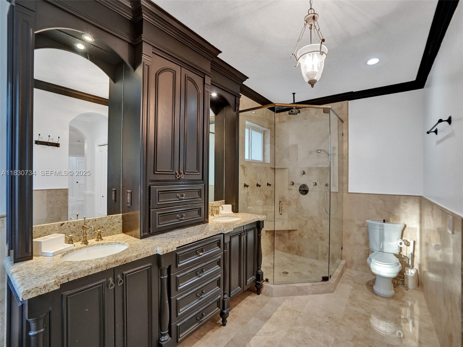 12401 Southwest 77th Street, Unit 12401 Miami, FL 33183 - Photo 25 of 95 a spacious bathroom with a granite countertop sink toilet and shower