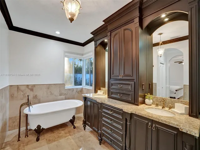 a kitchen with stainless steel appliances granite countertop a stove sink and cabinets