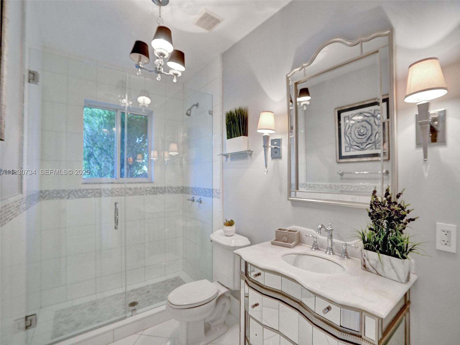 12401 Southwest 77th Street, Unit 12401 Miami, FL 33183 - Photo 29 of 95 a bathroom with a sink vanity granite and toilet