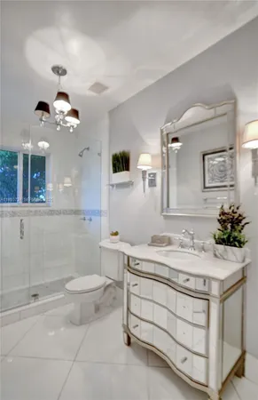 a kitchen with stainless steel appliances granite countertop a sink a stove and a granite counter tops