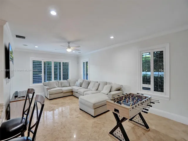 a view of a house with backyard porch and sitting area