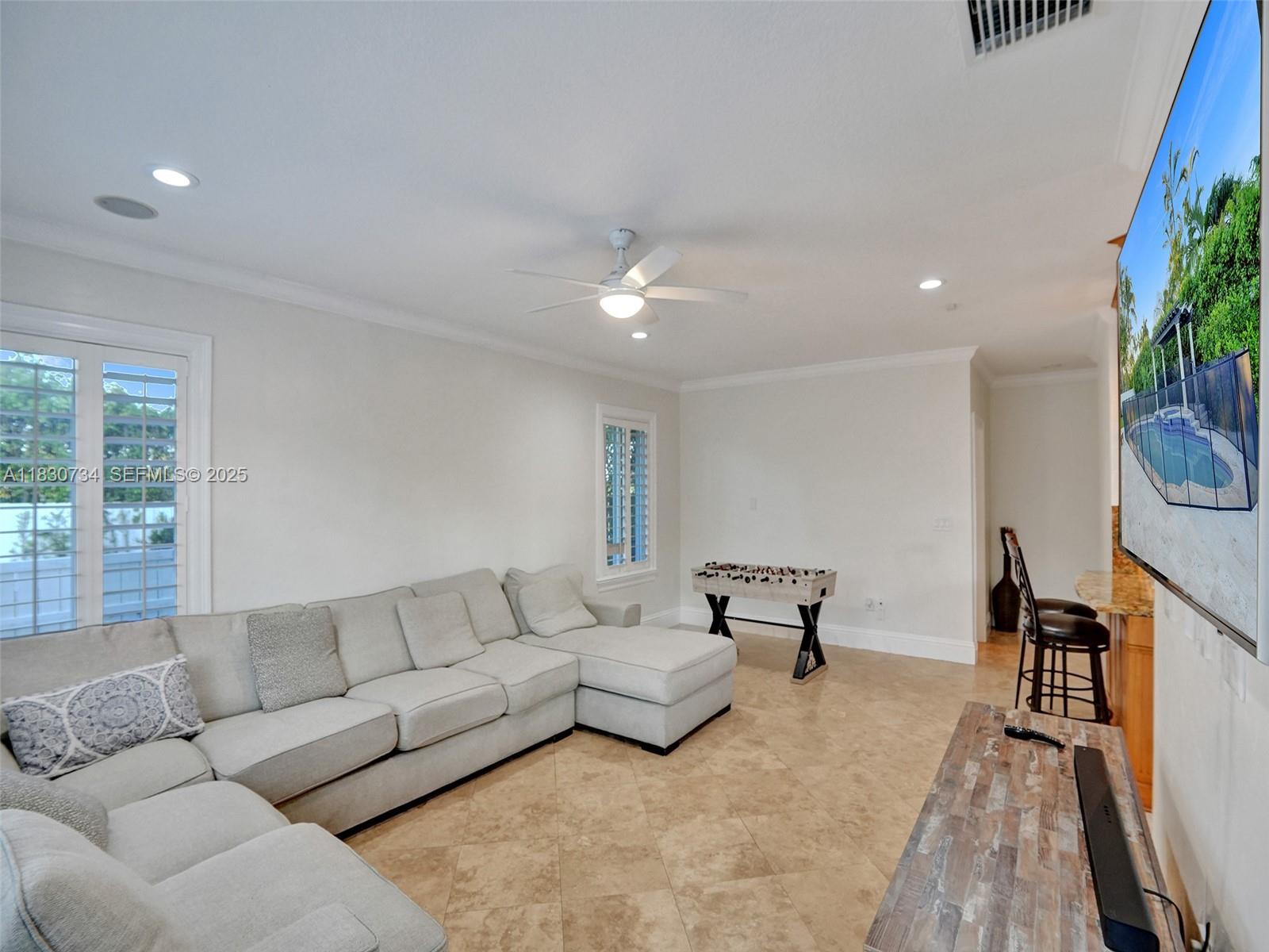 12401 Southwest 77th Street, Unit 12401 Miami, FL 33183 - Photo 33 of 95 a living room with furniture and a couch