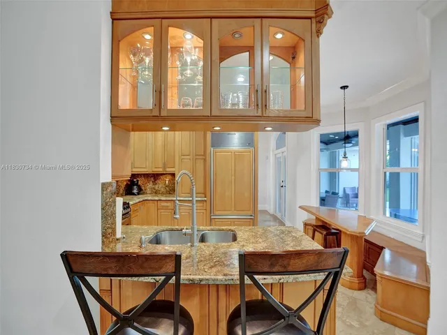 a view of a house with pool porch and sitting area