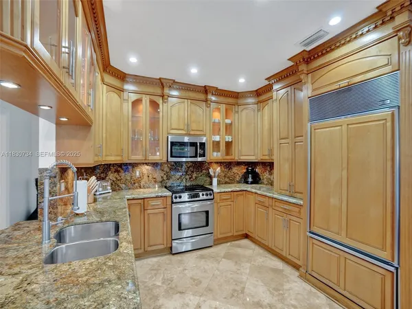 a living room with fireplace furniture and a flat screen tv