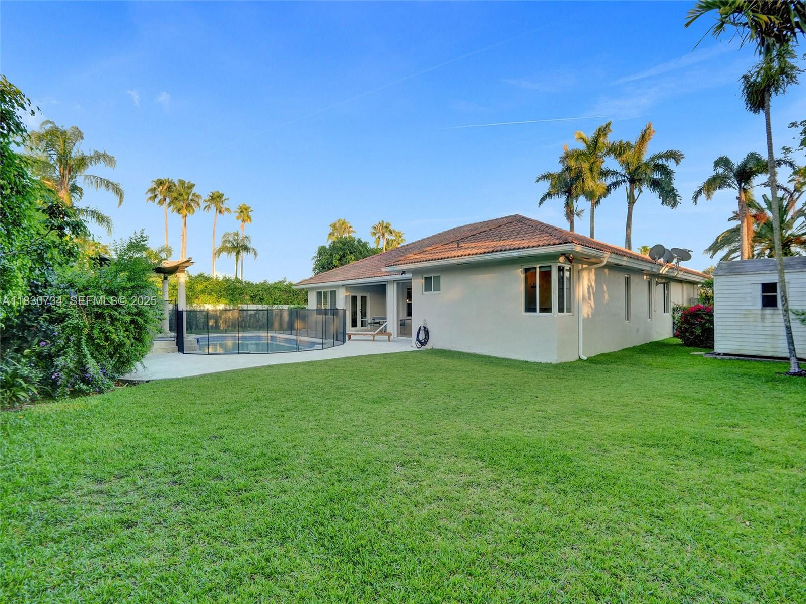 12401 Southwest 77th Street, Unit 12401 Miami, FL 33183 - Photo 52 of 95 a front view of a house with garden