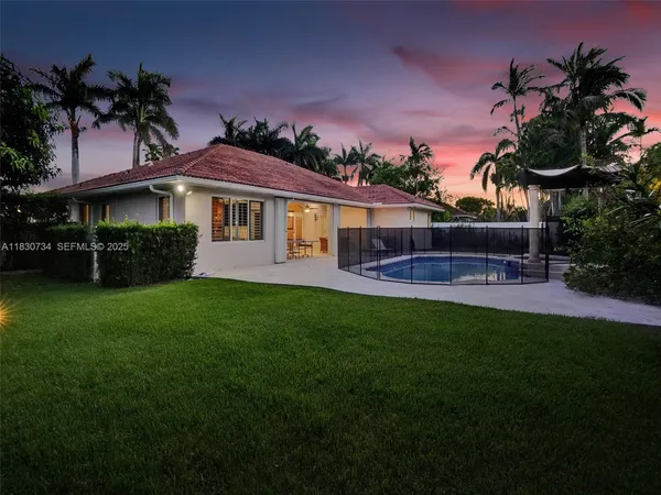 a view of a swimming pool with a patio