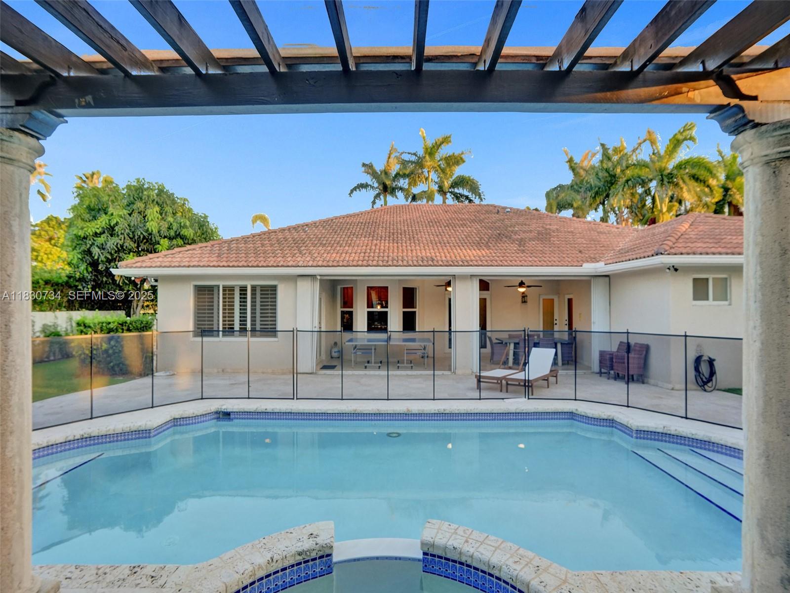 12401 Southwest 77th Street, Unit 12401 Miami, FL 33183 - Photo 64 of 95 a front view of a house with garden