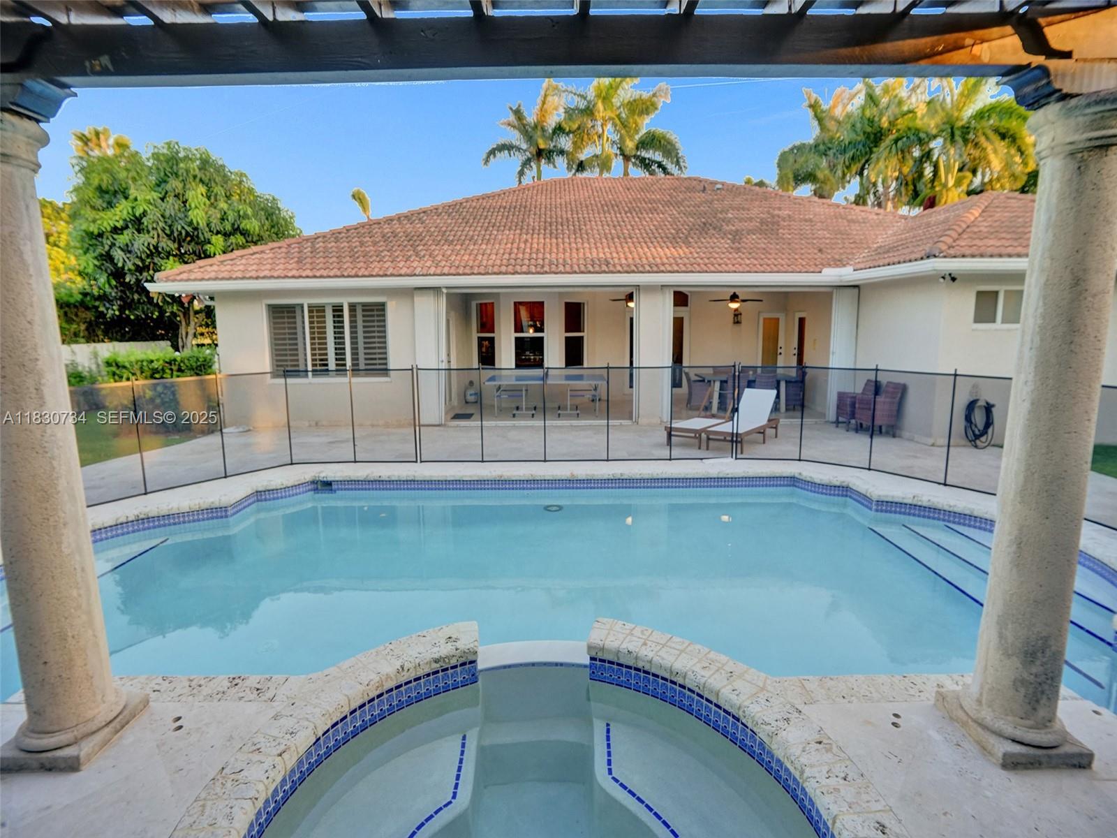 12401 Southwest 77th Street, Unit 12401 Miami, FL 33183 - Photo 65 of 95 a view of a house with pool porch and sitting area