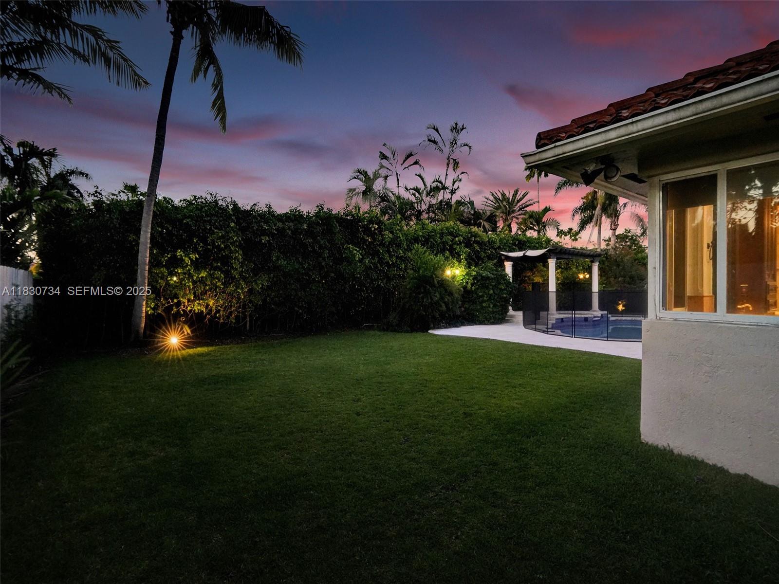 12401 Southwest 77th Street, Unit 12401 Miami, FL 33183 - Photo 7 of 95 a front view of a house with a garden