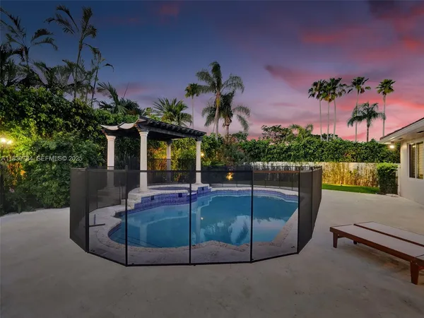 a view of house with backyard outdoor seating and entertaining space