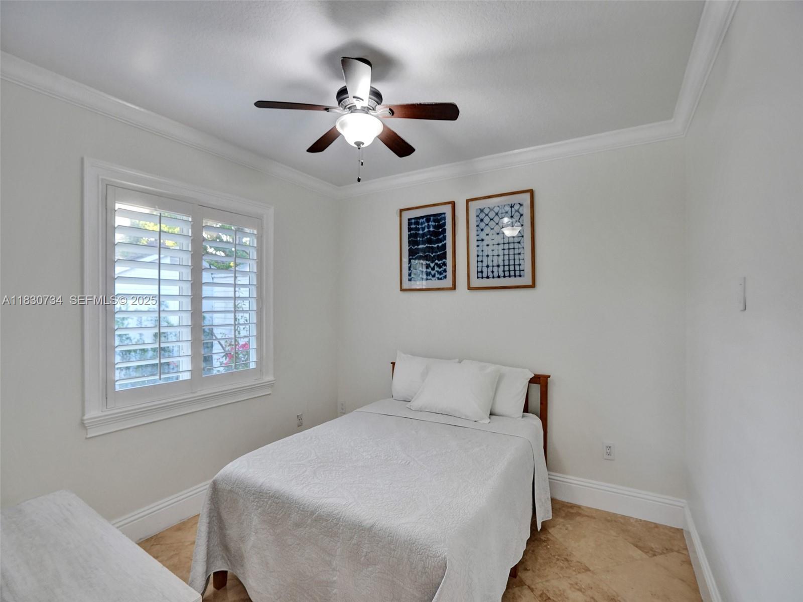 12401 Southwest 77th Street, Unit 12401 Miami, FL 33183 - Photo 95 of 95 a bedroom with a large bed and a window