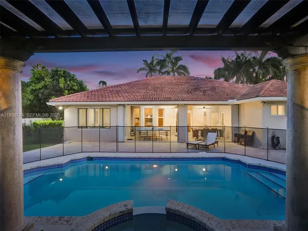 a view of a patio with table and chairs potted plants with wooden floor