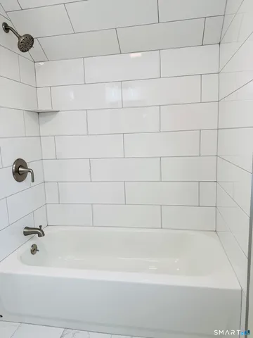 a view of a room with wooden walls