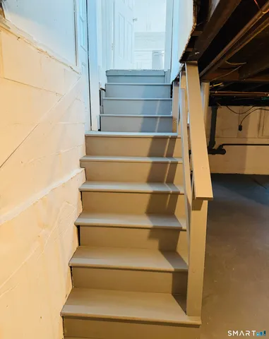 a view of a ocean with a car parked on the road