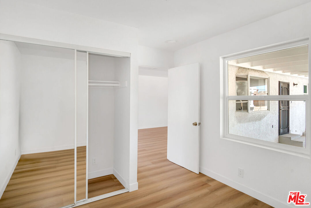15376 Washoan Road Apple Valley, CA 92307 - Photo 11 of 40 a view of wooden floor and windows in a room