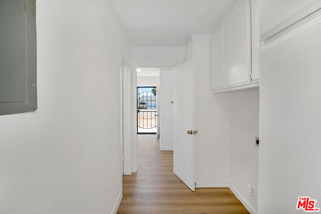 15376 Washoan Road Apple Valley, CA 92307 - Photo 15 of 40 a view of wooden floor and windows in a room