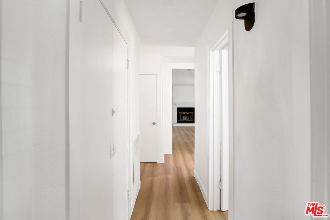 15376 Washoan Road Apple Valley, CA 92307 - Photo 17 of 40 a view of a hallway with wooden floor