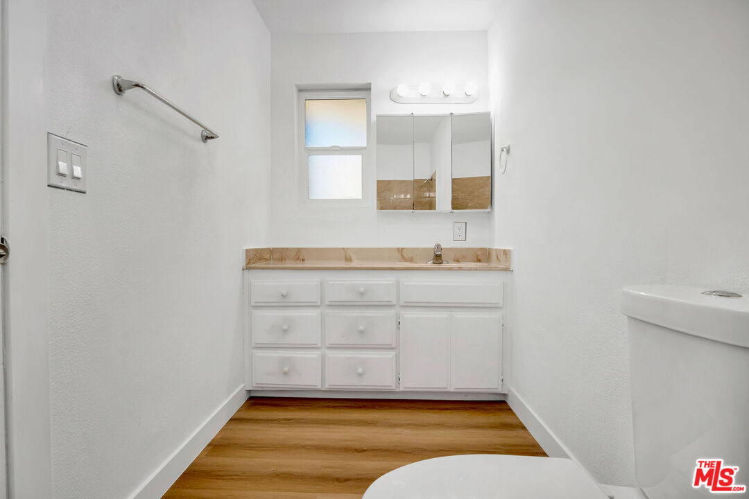 15376 Washoan Road Apple Valley, CA 92307 - Photo 22 of 40 a bathroom with a sink and a mirror